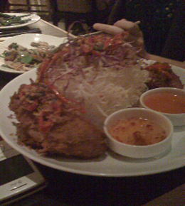 Thai Fried Chicken Half ($18) was rather enormous, leaning against a tower of fried rice noodles and served with two sauces.
