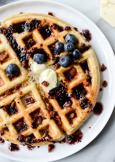 Crispy Bacon Waffles with Bourbon Butter and Blueberry Syrup