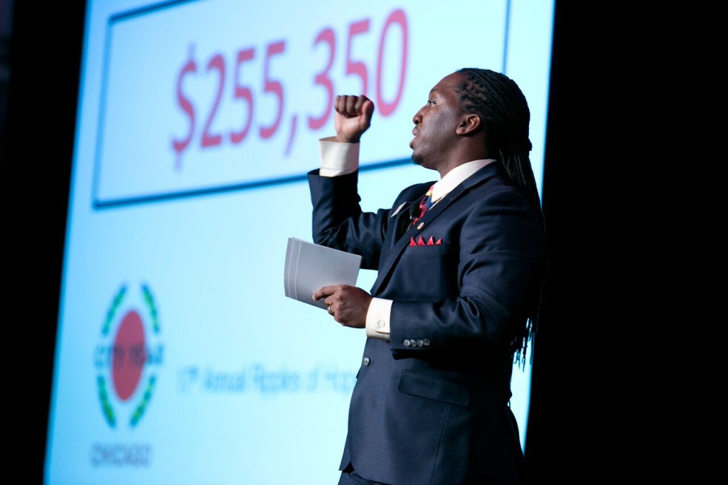 Jamar Beyonu of City Year Chicago helps the organization raise just over $250,000 from attendees of the Ripples of Hope Awards Dinner