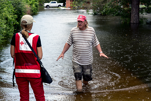 August 16, 2016. Gonzales, Louisiana. David Moore in a flooded neighborhood. Photo by: Marko Kokic/American Red Cross