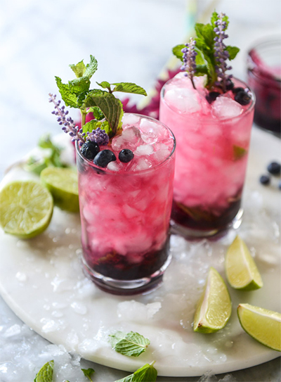 8 Fresh Recipes Using Seasonal Produce: Blueberry Mojitos With Lavender Syrup from How Sweet It Is