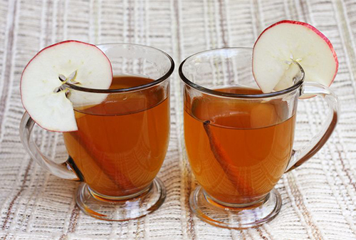 apple cider cocktail recipes: Spiced Apple Cider from A Beautiful Mess