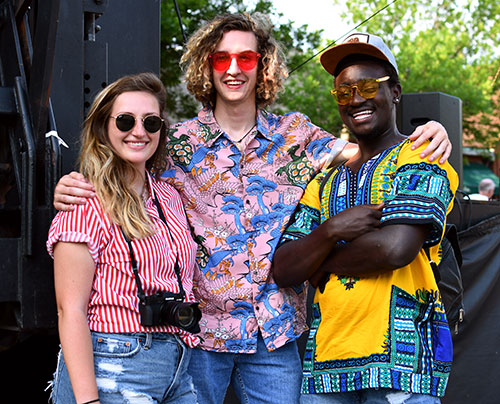 festival outfits: Hannah Hughes, Duncan Hughes, and Apollo Mbuki
