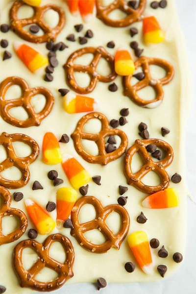 Halloween Candy Recipes: Candy Corn and Pretzel Chocolate Bark from Brown Eyed Baker