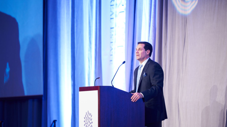 Harold E. Eisenberg Foundation Board President Peter Eisenberg on stage