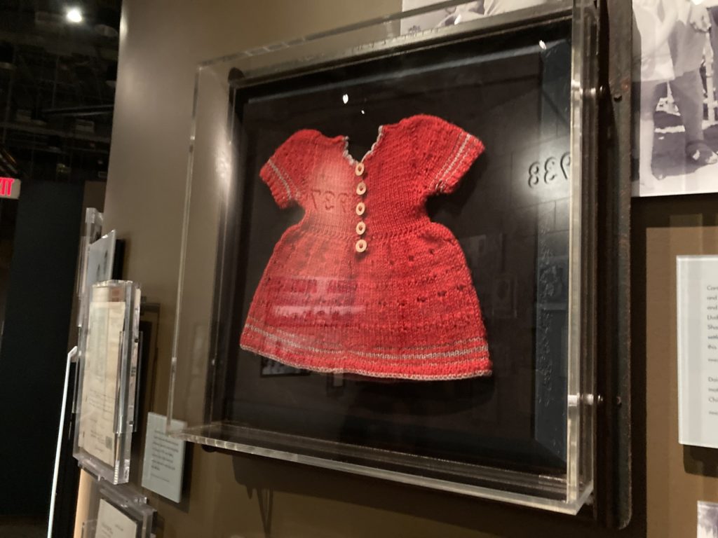 holocaust exhibit red sweater
