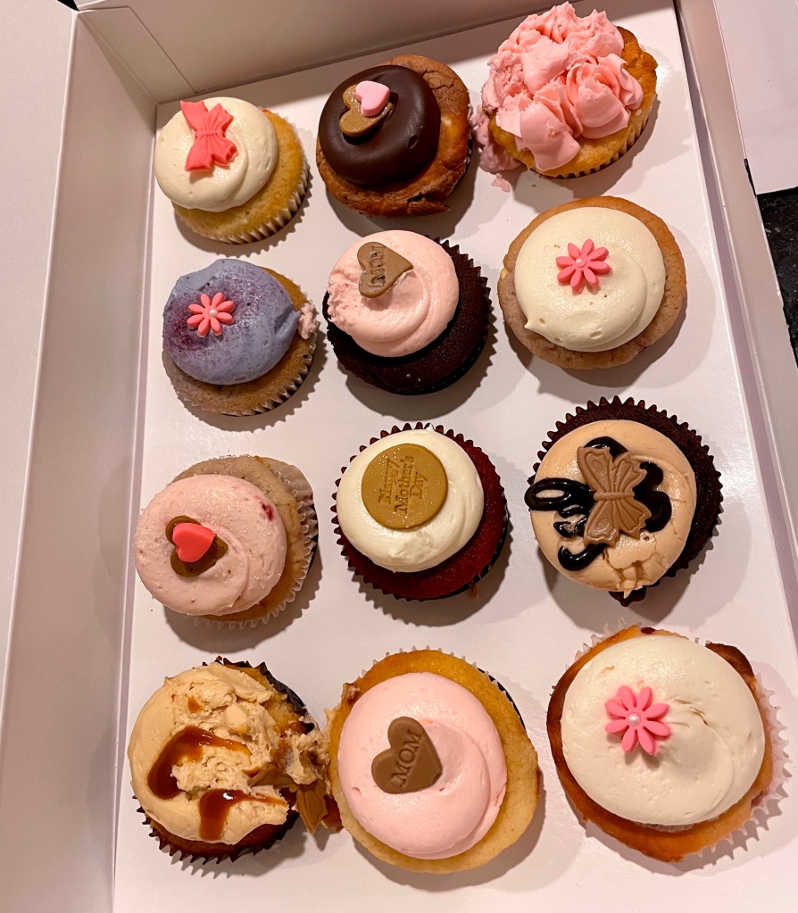 Even slightly mangled in transit, I couldn’t resist the Georgetown Cupcakes my sister brought for our celebratory Mother’s Day dinner.