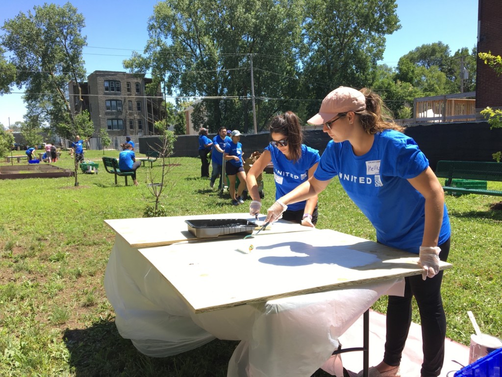 volunteers in englewood community garden