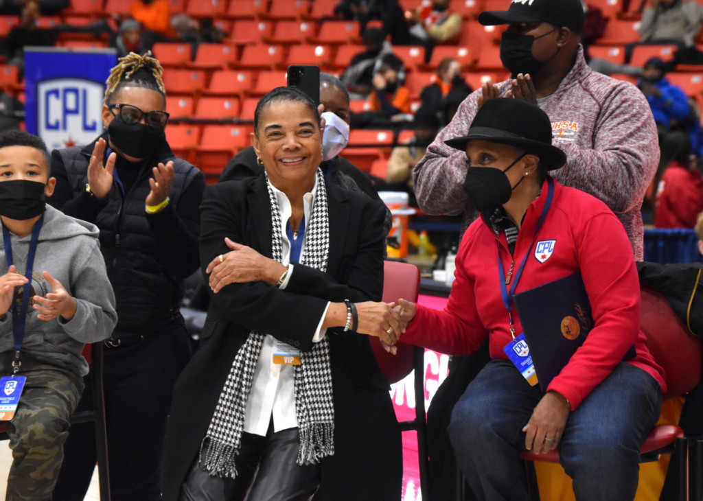 Legendary Marshall High School girls basketball coach Dorothy Gaters shakes the hand of Chicago Mayor Lori Lightfoot while being honored at halftime of the 2022 Chicago Public League girls basketball championship game for a lifetime of achievement in girls basketball | Photo by: Kaleb Carter