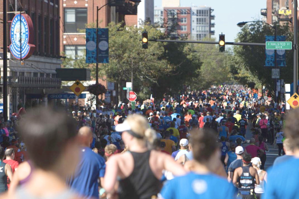 Runners pass through Greektown during a past Chicago Marathon