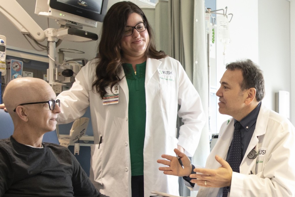 Celalettin Ustun, MD, talks with a patient | Photo courtesy of RUSH