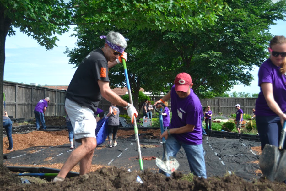 Ric Estrada and Roger Hochschild, CEO and President of Discover Financial Services building a playground at the Family Shelter Service of Metropolitan Family Services DuPage Emergency Domestic Violence Shelter.
