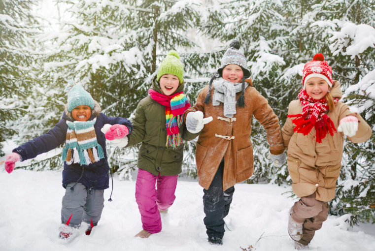 children in coats, in snow, Photo courtesy of Cradles to Crayons