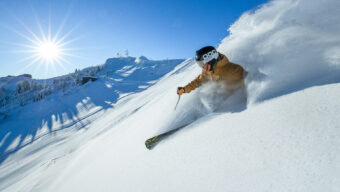 skier skiiing down slopes