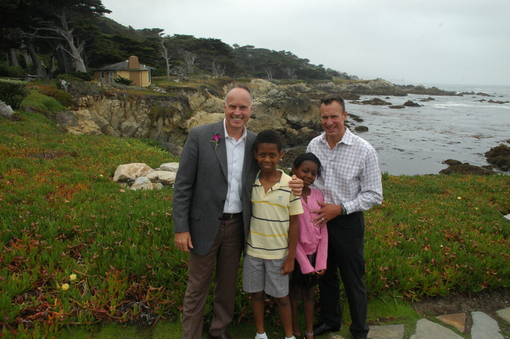 Dr. Jeff Boehm (left) and partner Keith Rosenthal with their children, Ty and Tamara. © The Marine Mammal Center.