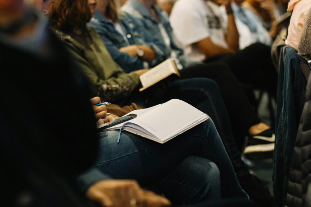 Photo of students taking notes in class--from Upsplash