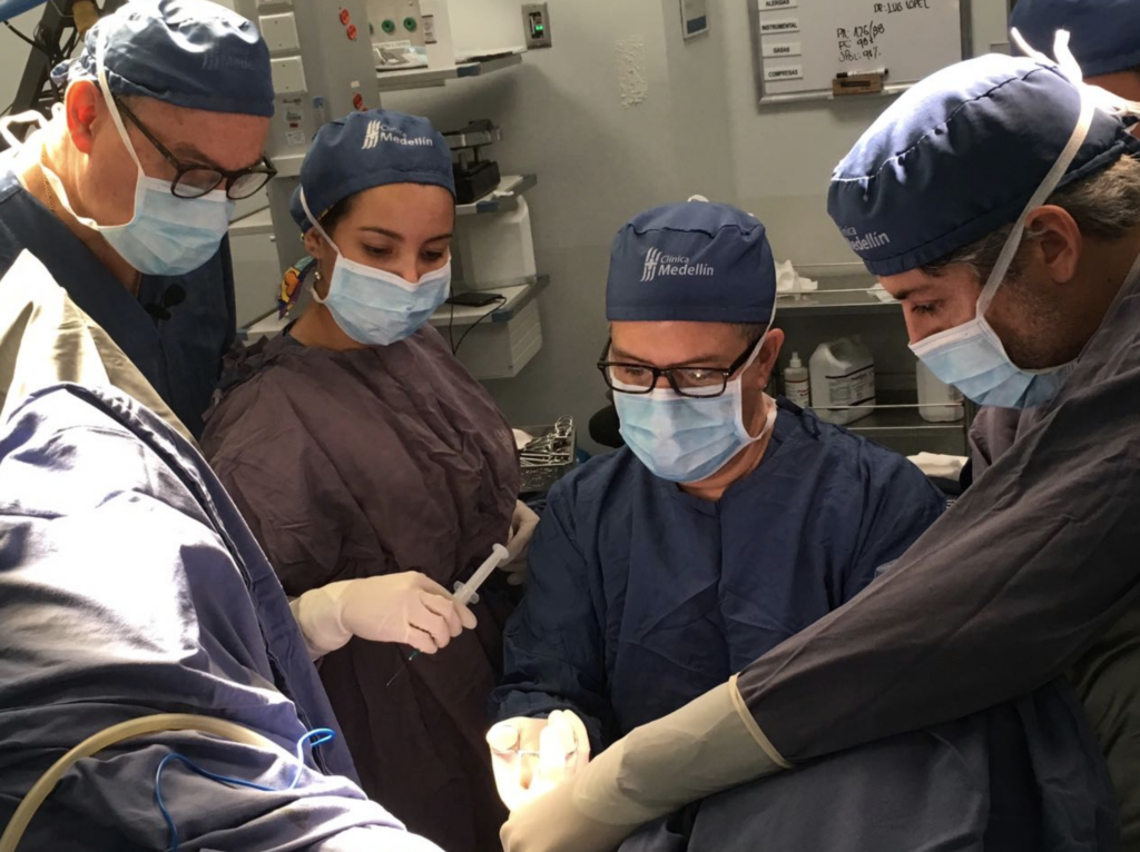 Dr. Roger Goldberg in surgery with medical team