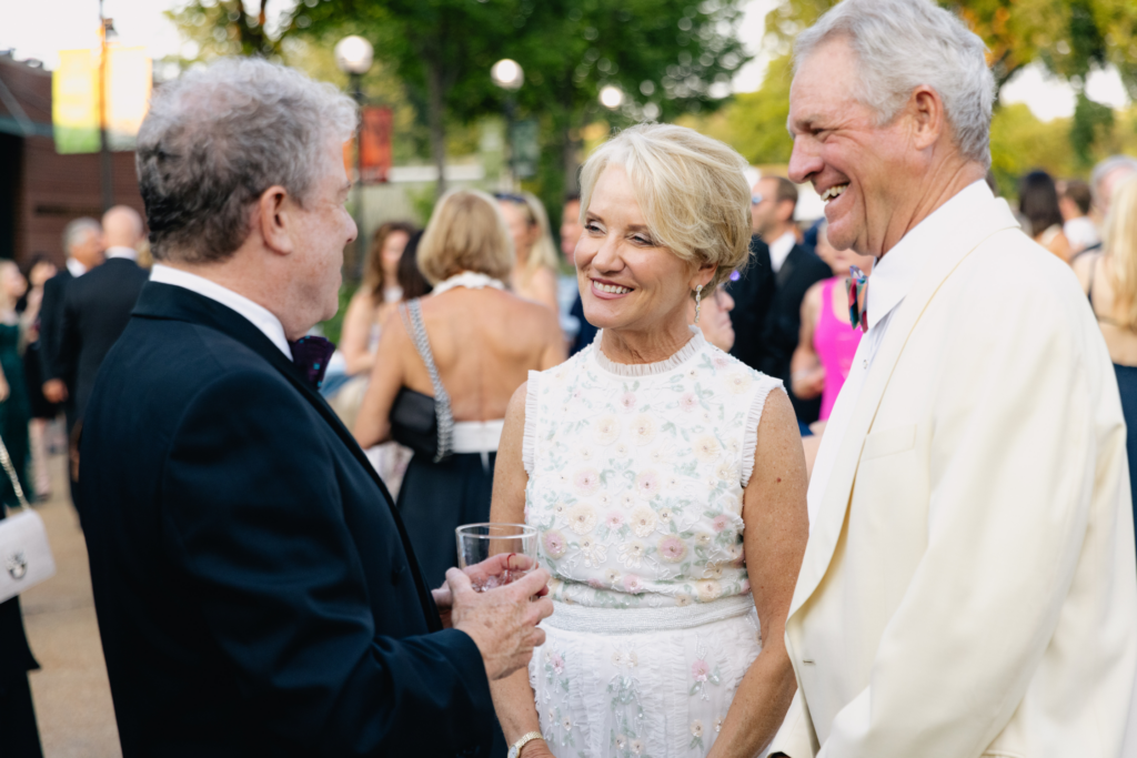 Board Chair Francesca M. Edwardson and husband John Edwardson
speaking with a fellow guest