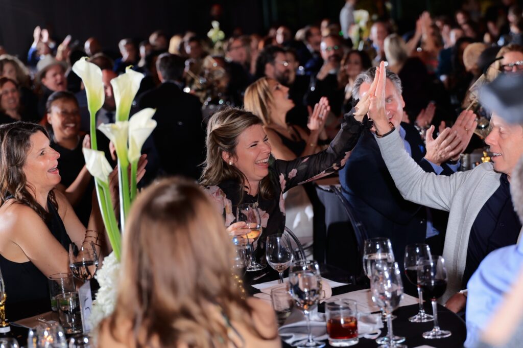 Cinema Soirée Guests High Five in Support of the Festival Fundraiser