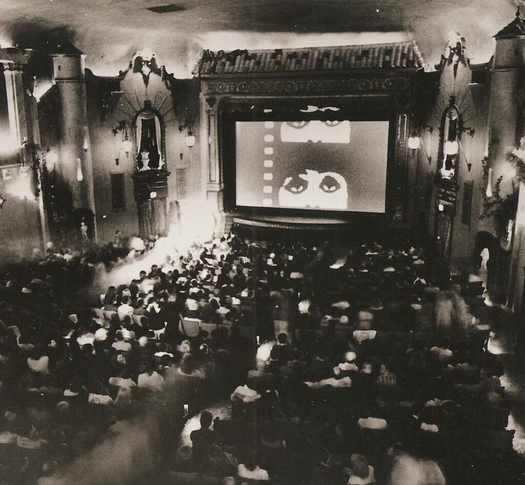 Black and white image of movie theater from early 20th century