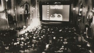 Black and white image of movie theater from early 20th century