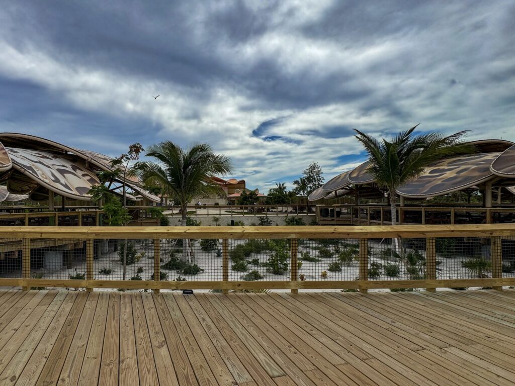 Shell rooftops and elevated boardwalk at Lookout Cay