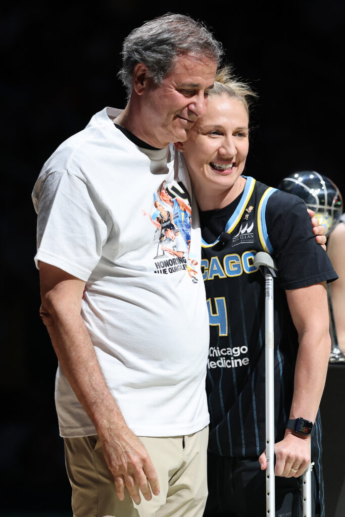 CHICAGO, ILLINOIS - JULY 09: Chicago Sky owner Michael Alter hugs Courtney Vandersloot #22 during Allie Quigley's jersey retirement ceremony at halftime between the Chicago Sky and the Dallas Wings at Wintrust Arena on July 09, 2025 in Chicago, Illinois.