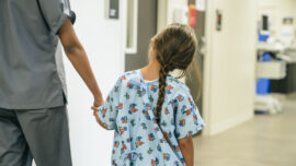 kid in hospital with nurse