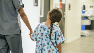 kid in hospital with nurse