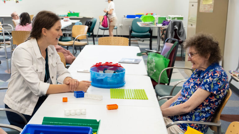 Avenues' Director of Clinical Services Erin Kalaway talks with client. Photo courtesy of Avenues to Independence.