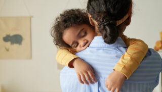 Girl Holding Sleeping baby
