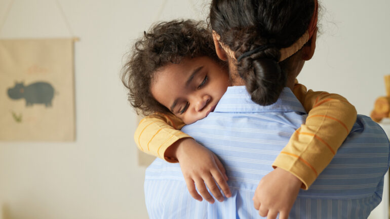 Girl Holding Sleeping baby