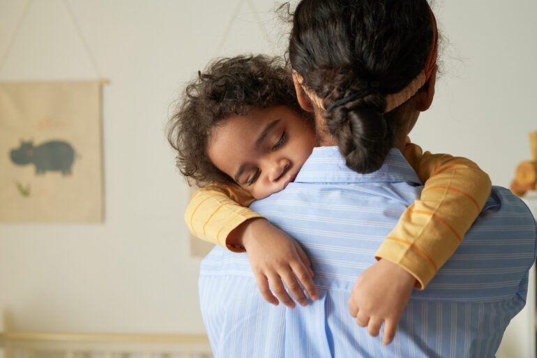 Girl Holding Sleeping baby