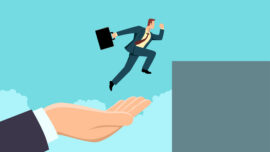Hand helping a businessman to jump higher